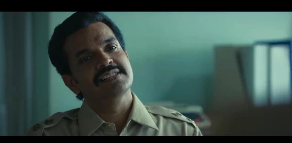 A police - like character looks determined in "Saare Jahan Se Accha".