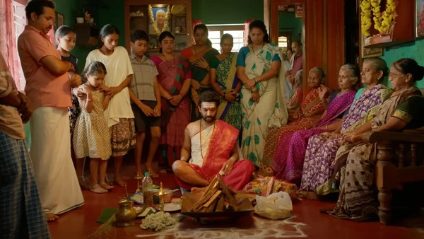 People gathered for a ritual in a room in the movie "Su from So".