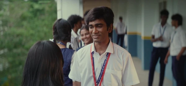 A student smiles while talking to a girl in a school setting in Dragon.