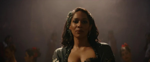 A woman stands in a spotlight in Kesari Chapter 2: The Untold Story of Jallianwala Bagh.